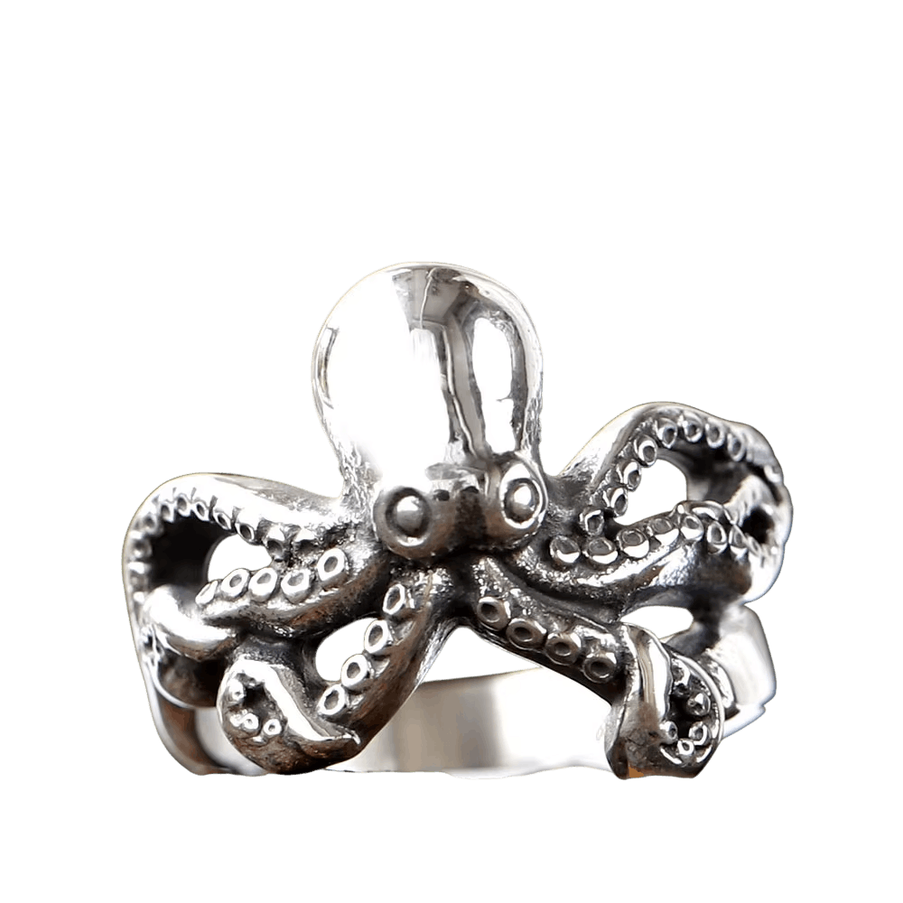 Bague en acier sculptée en forme de pieuvre, tête bombée et tentacules à ventouses formant l'anneau