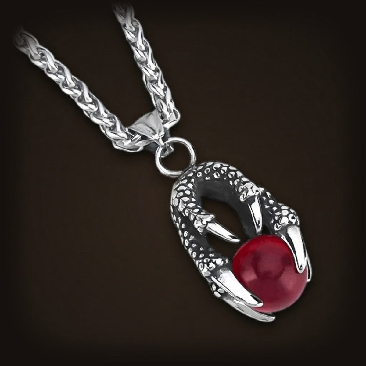 Pendentif griffe de dragon en acier inoxydable tenant une perle rouge, sur sa chaîne tressée