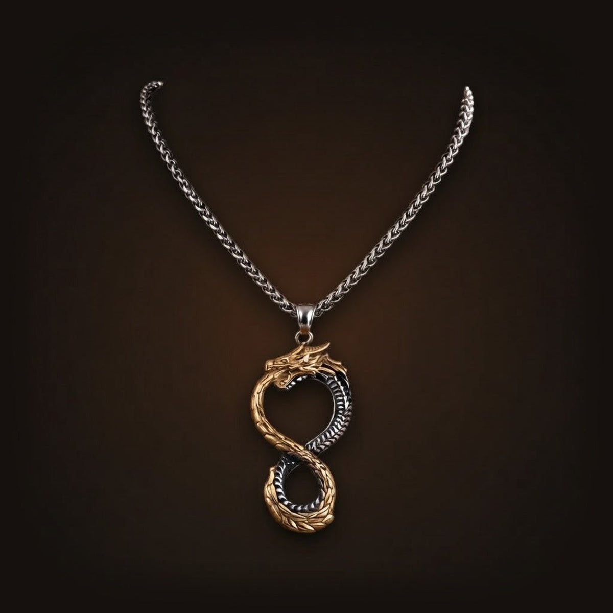 Pendentif ouroboros bicolore en acier et placage or, deux serpents formant un huit