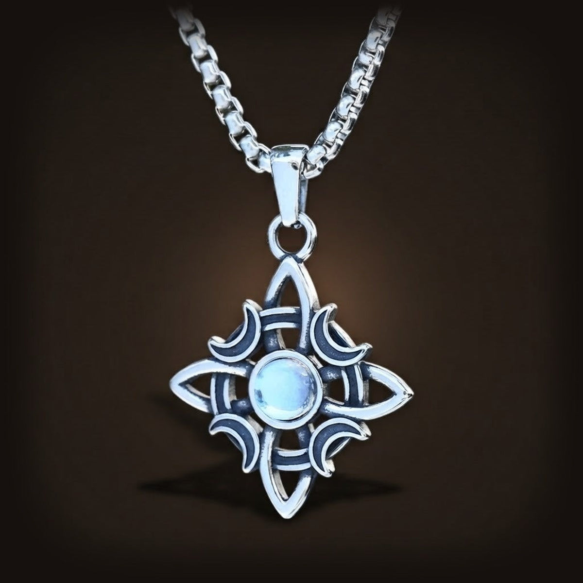 Pendentif nœud de sorcière à quatre pointes en acier 316L, croissants de lune et cabochon blanc bleuté