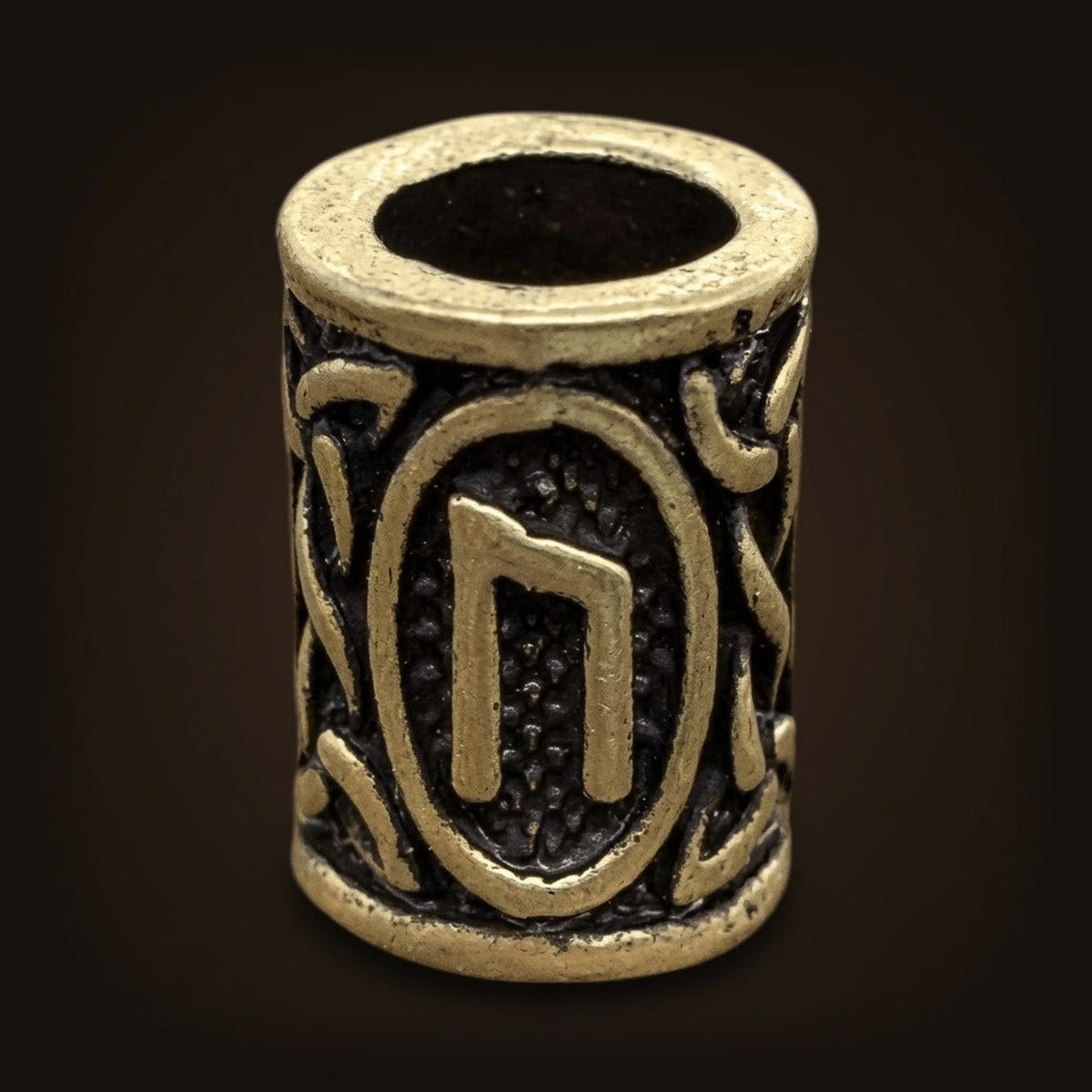 Perle viking cylindrique en alliage bronze patiné, rune Uruz, perçage traversant visible
